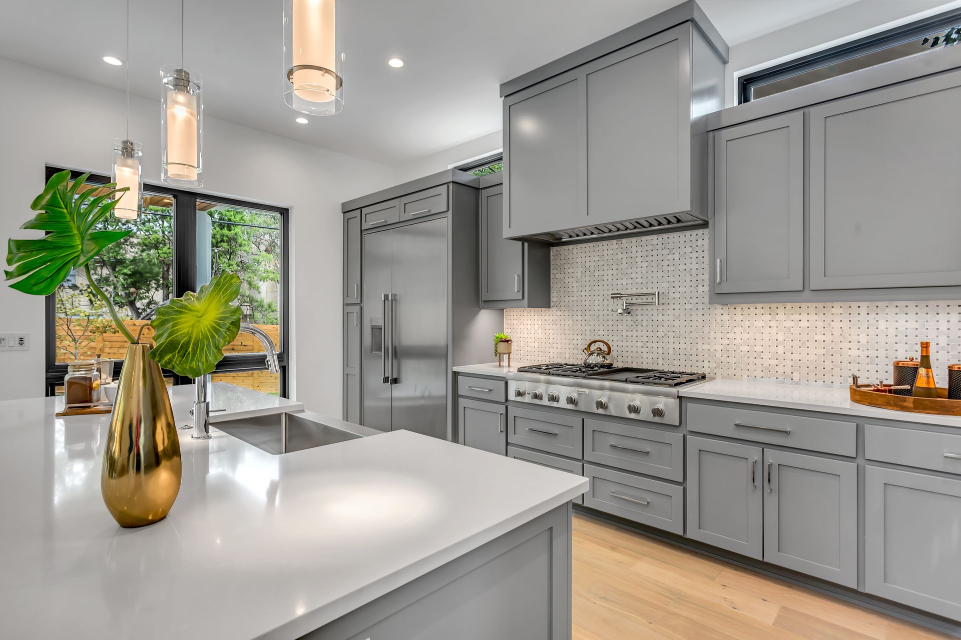 Modern Warm Minimal Kitchen with black cabinetry and illuminated oak finish